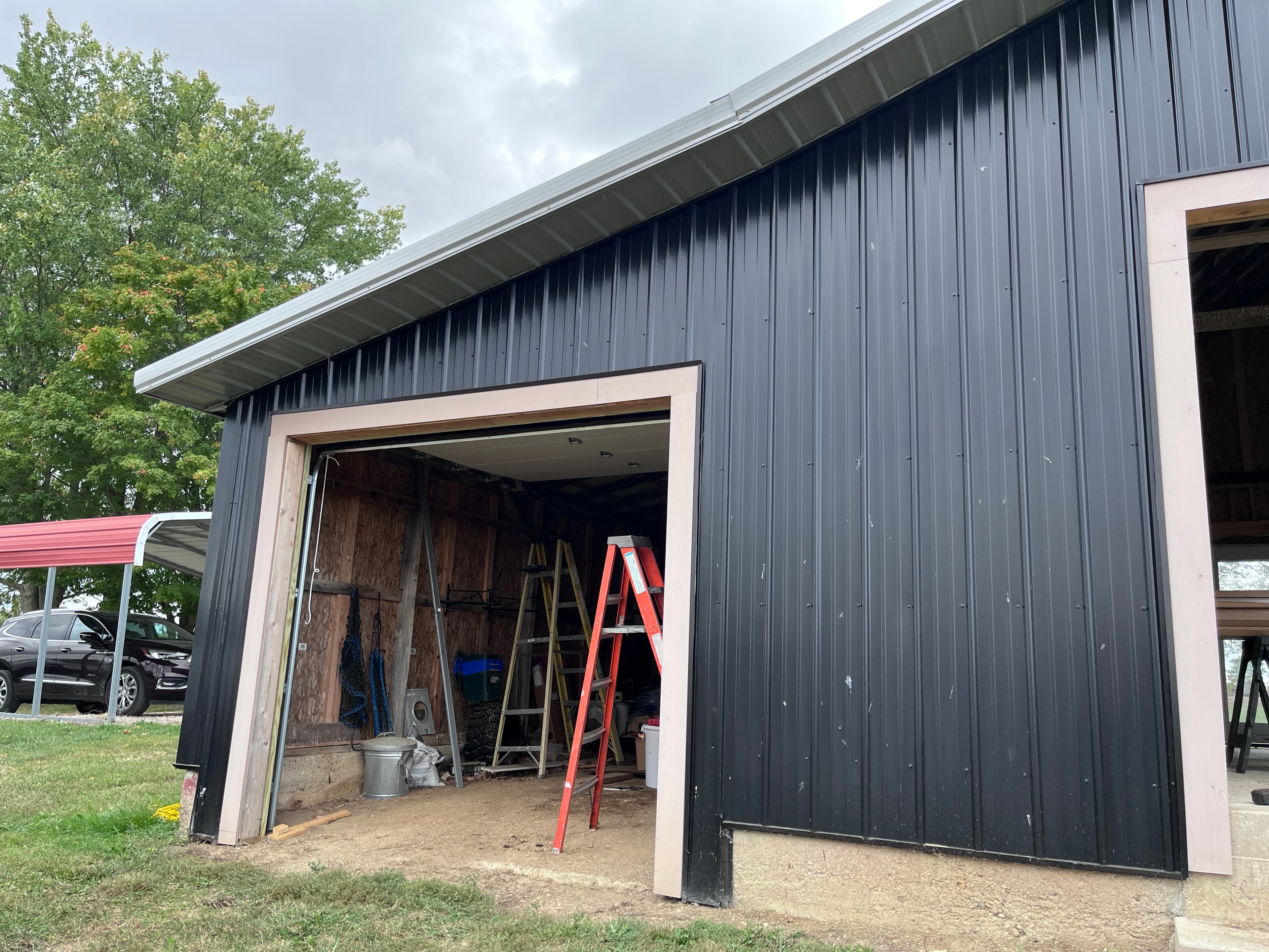 Rough opening in steel barn building before garage door installation